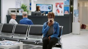 African american patient with cervical neck foam at healthcare center